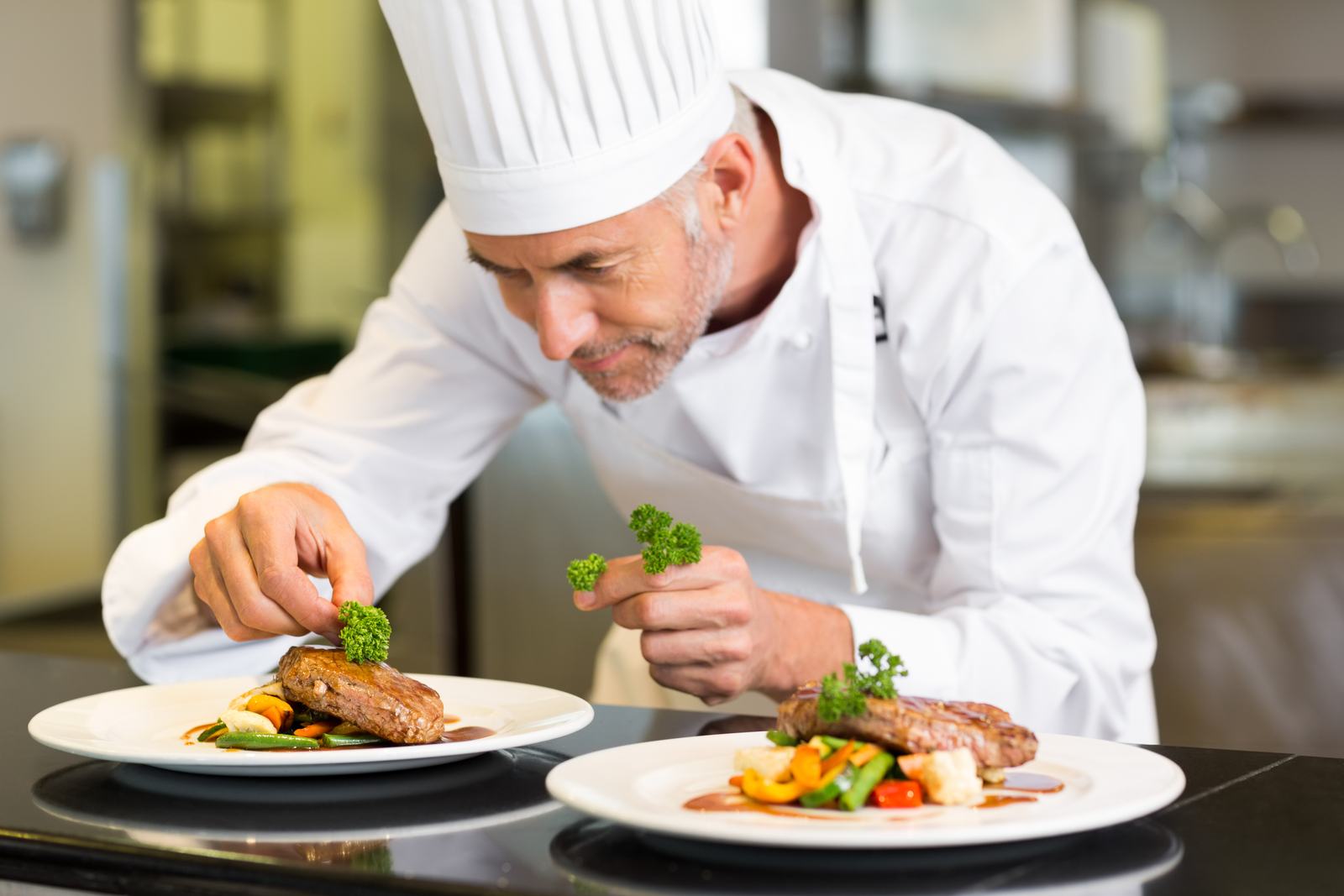 A chef plating a dish