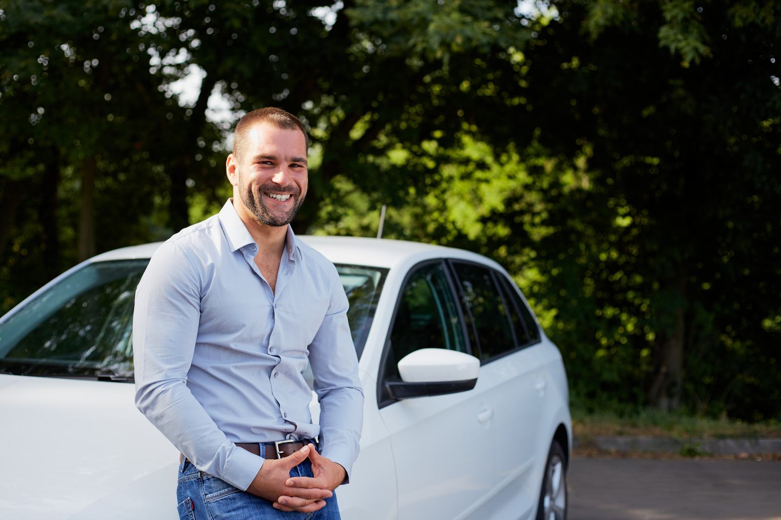 A driver next to his car
